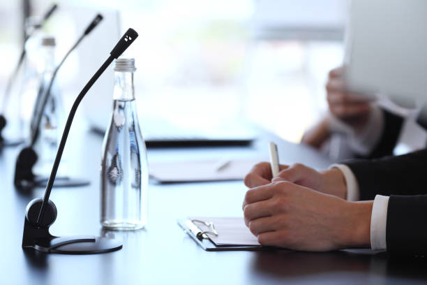 istock Speakers at business meeting 801911142