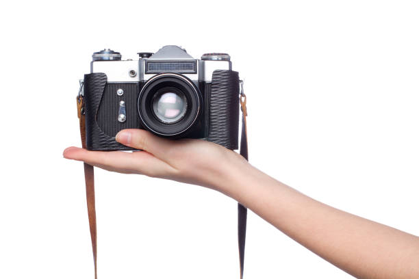 old camera on woman hand over white stock photo