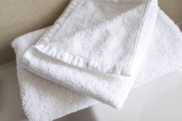 istock White cotton towels in a hotel bathroom 801924778