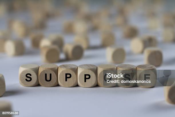 Suppose Cube With Letters Sign With Wooden Cubes Stock Photo - Download Image Now