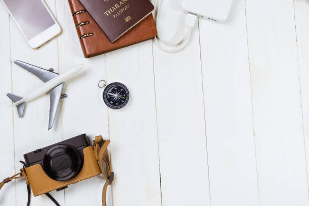 istock Vacation travel equipment on white wooden copy space 801958678