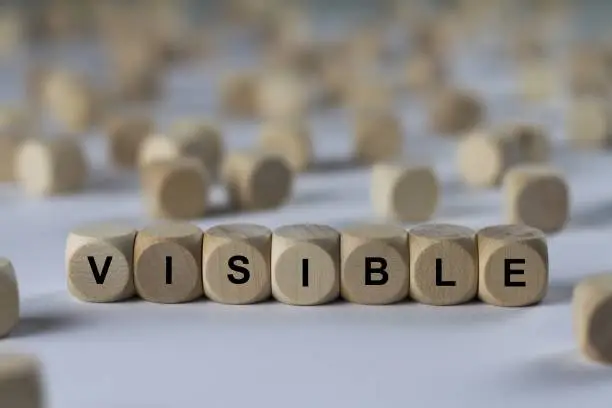 Photo of visible - cube with letters, sign with wooden cubes
