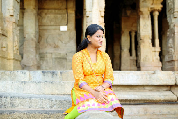 istock Female Sitting in the Temple Premises 801994410