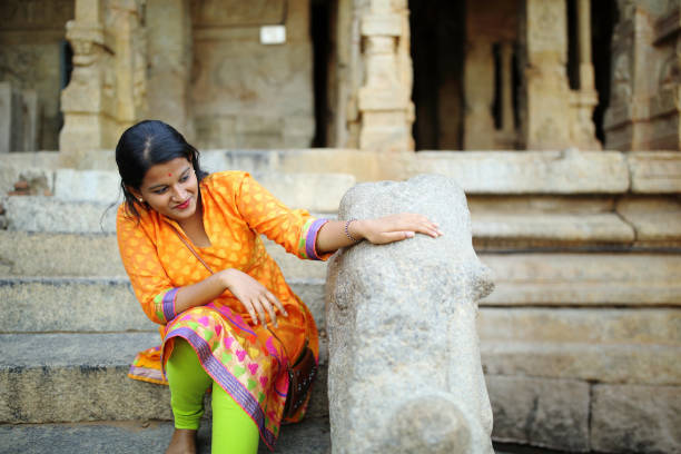 istock Girl Touching the Stone Carved Sculpture 802001424