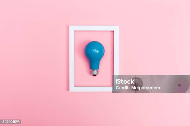 Colored Lightbulb On A Pink Background Stock Photo - Download Image Now - Above, Abstract, Arts Culture and Entertainment