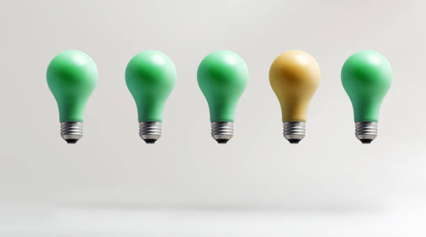 istock One out concept with green and yellow light bulbs 802001664