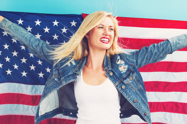 istock Young woman holding American flag 802004840