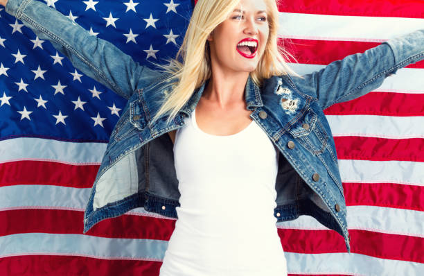 istock Young woman holding American flag 802004848