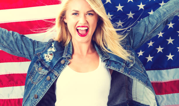 istock Young woman holding American flag 802004880