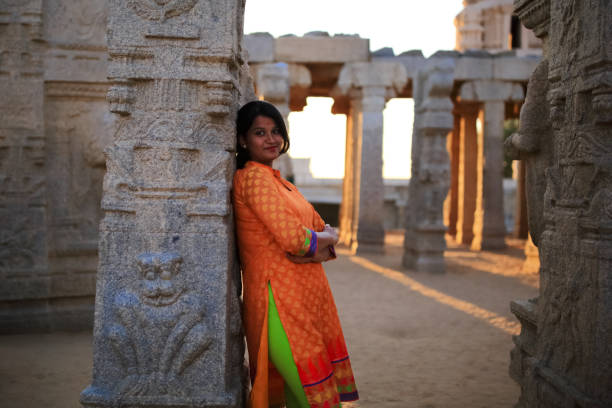 istock Beautiful Female Stands Posing in Ruined Site 802008610