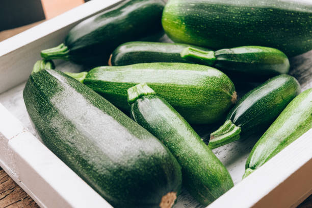 istock Fresh farmer organic zucchini on a wooden background 802010766