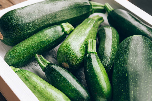 istock Fresh farmer organic zucchini on a wooden background 802010786