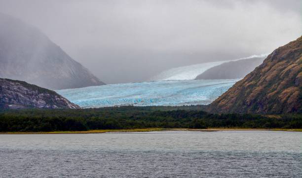 The Alemania Glacier in the Glacier alley of the Beagle Channel View of Alemania (German) Glacier north branch of the Beagle Channel Chile with the Cordillera Darwin as a backdrop beagle channel photos stock pictures, royalty-free photos & images