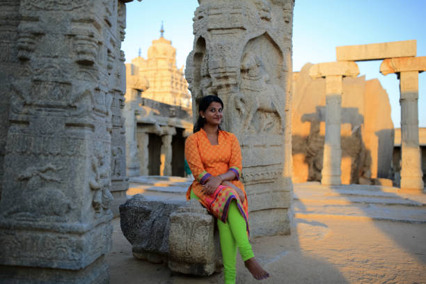 istock Beautiful Female Sitting at Lepakshi Temple 802014046
