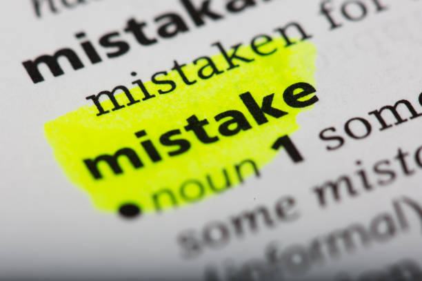 istock Word mistake printed and defined in a English dictionary 802026822
