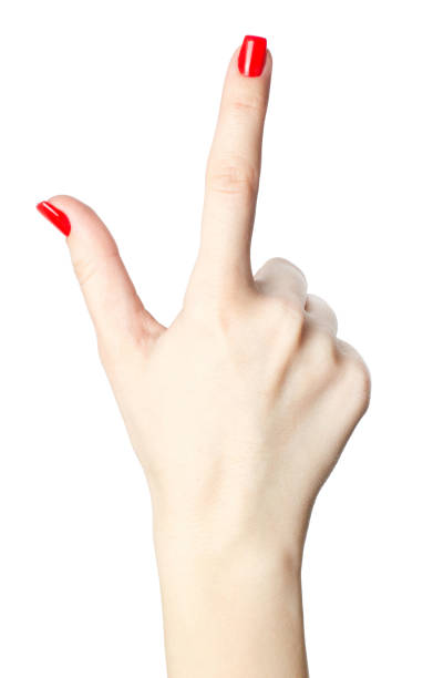 close-up da mão de uma mulher com vermelho unhas dedo índice apontando em fundo branco. - business pointing women index finger - fotografias e filmes do acervo