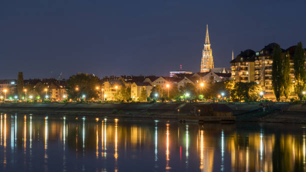 River Drva coast reflection by night in city Osijek, Croatia River Drva coast reflection by night in city Osijek, Croatia osijek photos stock pictures, royalty-free photos & images