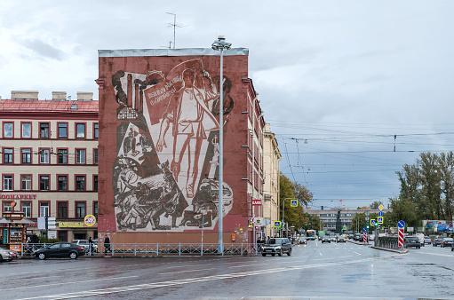 Saint Petersburg: Narva Square (known as Stachek Square  or Square of the Strikes), with its historical mural painting and one of the most famous rallying cries from the Communist Manifesto, the political slogan Workers of the world, unite!