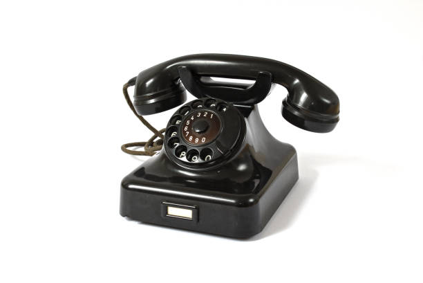Old black rotary dial telephone stock photo