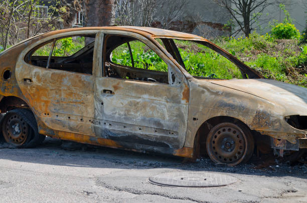 istock Burned car parked on the street side view 802048162