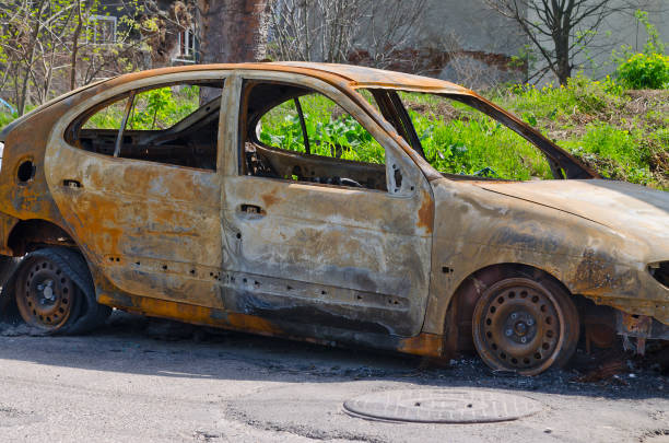 istock Burned car parked on the street side view 802048204