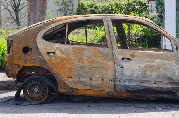 istock Burned car parked on the street side view 802048222