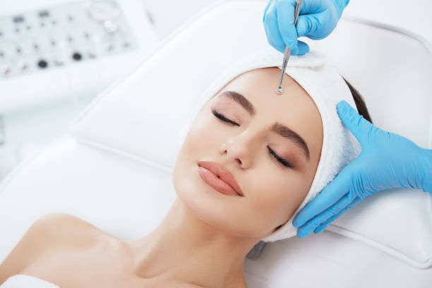 istock Cute girl doing cosmetic procedure 802048328