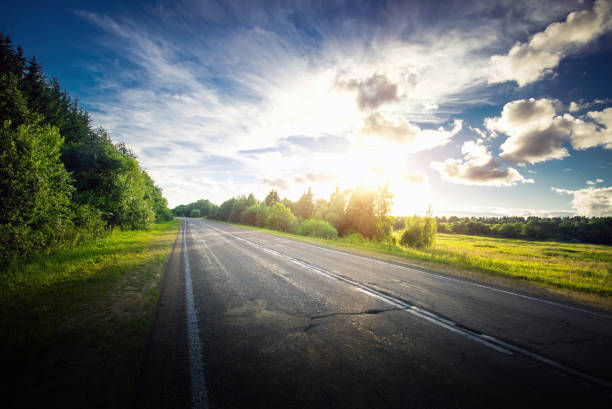 istock Sunrise beautiful road in forest 802064372