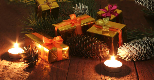 istock Celebration composition. Christmas candles and gift boxes. 802074758