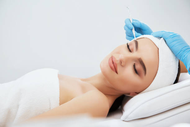 istock Gorgeous girl doing cosmetic procedure 802076526