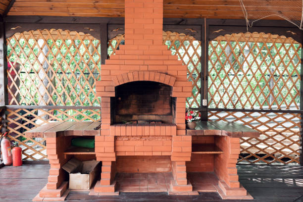 Old garden heater. grill usable for BBQ. a wooden deck