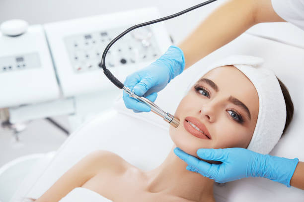 istock Cute girl doing cosmetic procedure 802124874