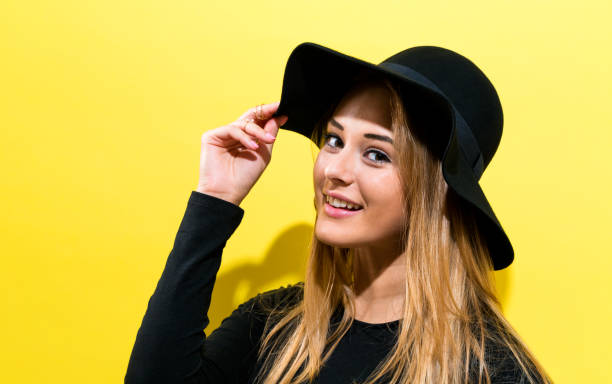 istock Happy young woman wearing a hat 802125350