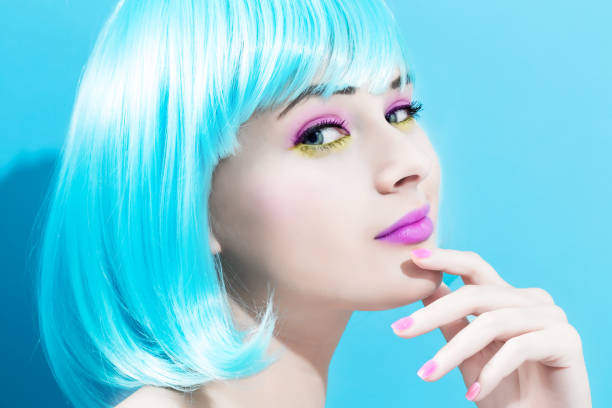 Beautiful woman in makeup with a bright blue wig