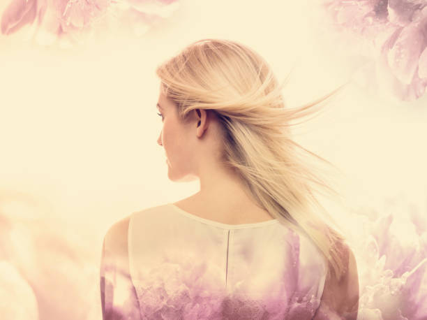 istock Young woman on a pink floral background 802127558