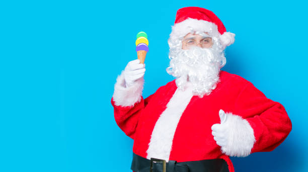 istock Funny Santa Claus have a fun with ice-cream 802133722