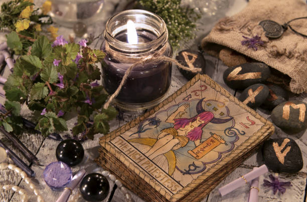 Black candle with the tarot cards and runes Halloween concept. Mystic background with occult and magic objects on witch table runes photos stock pictures, royalty-free photos & images