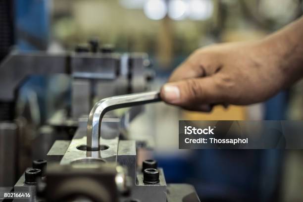 Worker Is Used Hexagonal Screwdriver In Factory Stock Photo - Download Image Now - Hex Wrench, Production Line, Hexagon