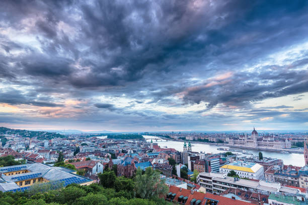 istock Parliament and riverside in Budapest Hungary with Dramatic sky during sunset 802169506
