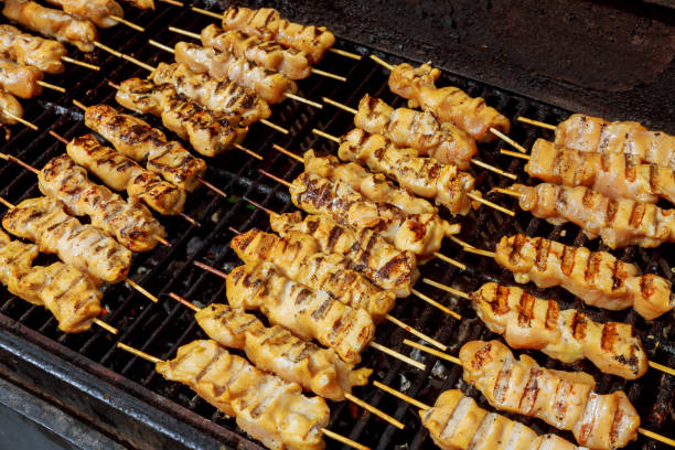 istock Marinated shashlik preparing on a barbecue grill over charcoal. 802172312