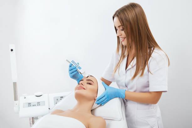 istock Gorgeous girl doing cosmetic procedure 802174700