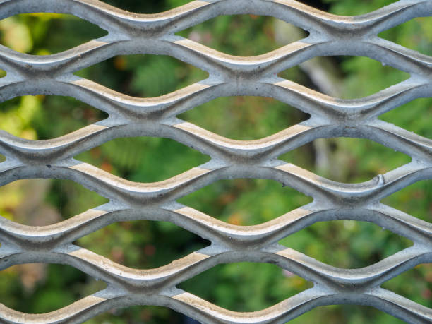 istock Metal net with green blured background. 802192936