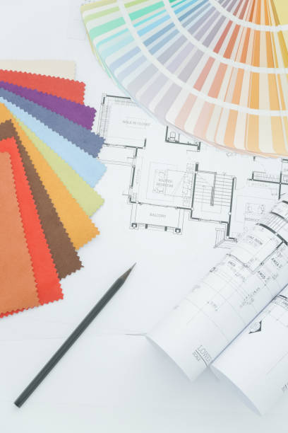 istock Interior designer working table with drawing, sample fabric and color palette 802218156