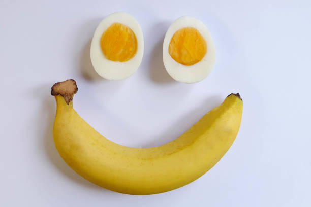 istock morning time with banana,egg,is breakfast on white background 802218706