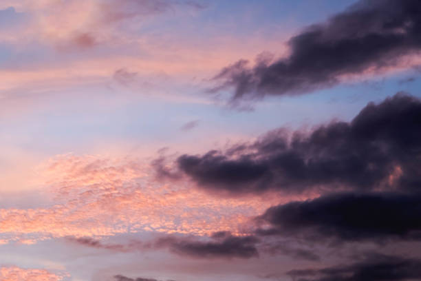istock pastel color pink and purple sky with cloud at sunset 802222680