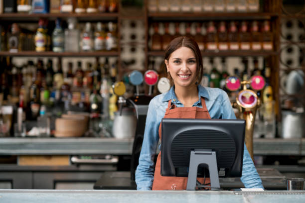 istock Happy woman working at a restaurant 802236842