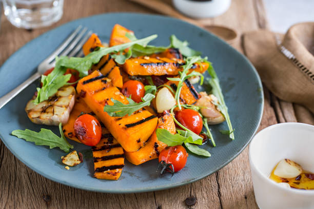 istock Grilled Butternut Squash with Cherry tomato and Rocket salad 802244602