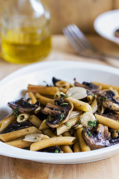 istock Penne with Button Mushroom in Herb sauce 802247526
