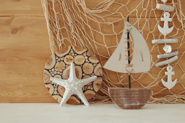 istock Nautical concept with sea life style objects on wooden table. Top view 802255826