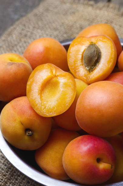 istock Delicious ripe apricots on a table. 802260626